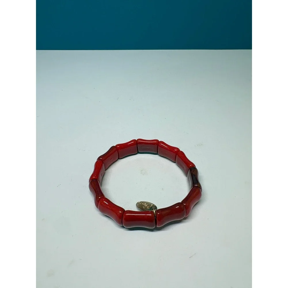 Plunder Design Red Bamboo Style Stretch Bracelet Gold Tone Logo Charm